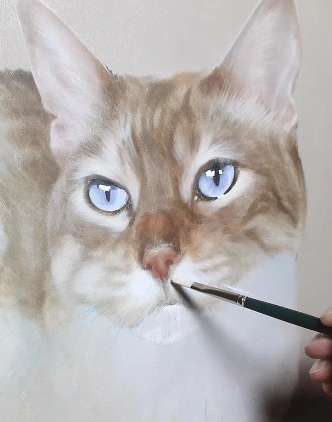 Close-up of Tia’s oil painting, highlighting the detailed fur and eye work.