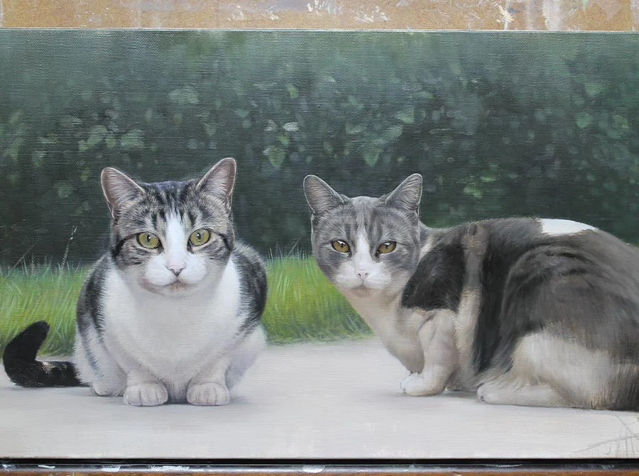 Close-up view of the framed oil painting of Milly and Molly, highlighting facial details.
