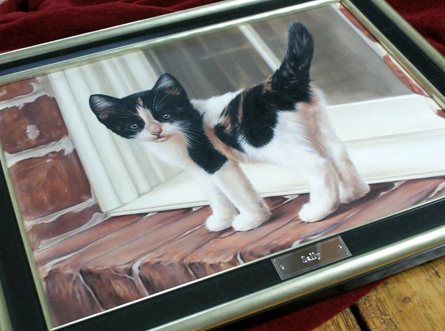 Kitten Oil Painting Framed and Displayed Kitten oil painting of Sally framed and displayed in a home setting.