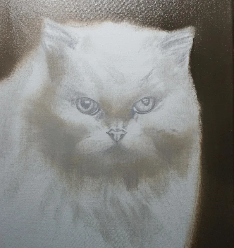 Client Greg proudly displaying the finished oil painting of Sophie the cat.