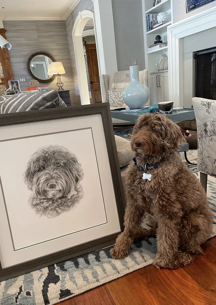 A wonderful photo of Parker with his pencil portrait framed by Melanie Phillips pencil portrait artist