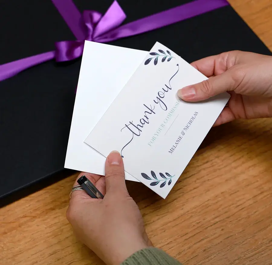 Elegant pet portrait gift wrapping with tissue paper, a custom gift box, and ribbon, perfect for a memorable presentation